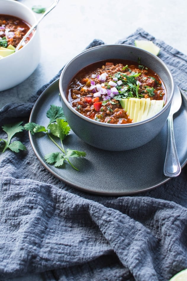 This crazy delicious chili is not only bean free (making it paleo and whole30 friendly), it's also loaded up with a rainbow of veggies - carrots, celery, onions, peppers, tomatoes, fennel and garlic that deliver serious flavor and mega nutrition!
