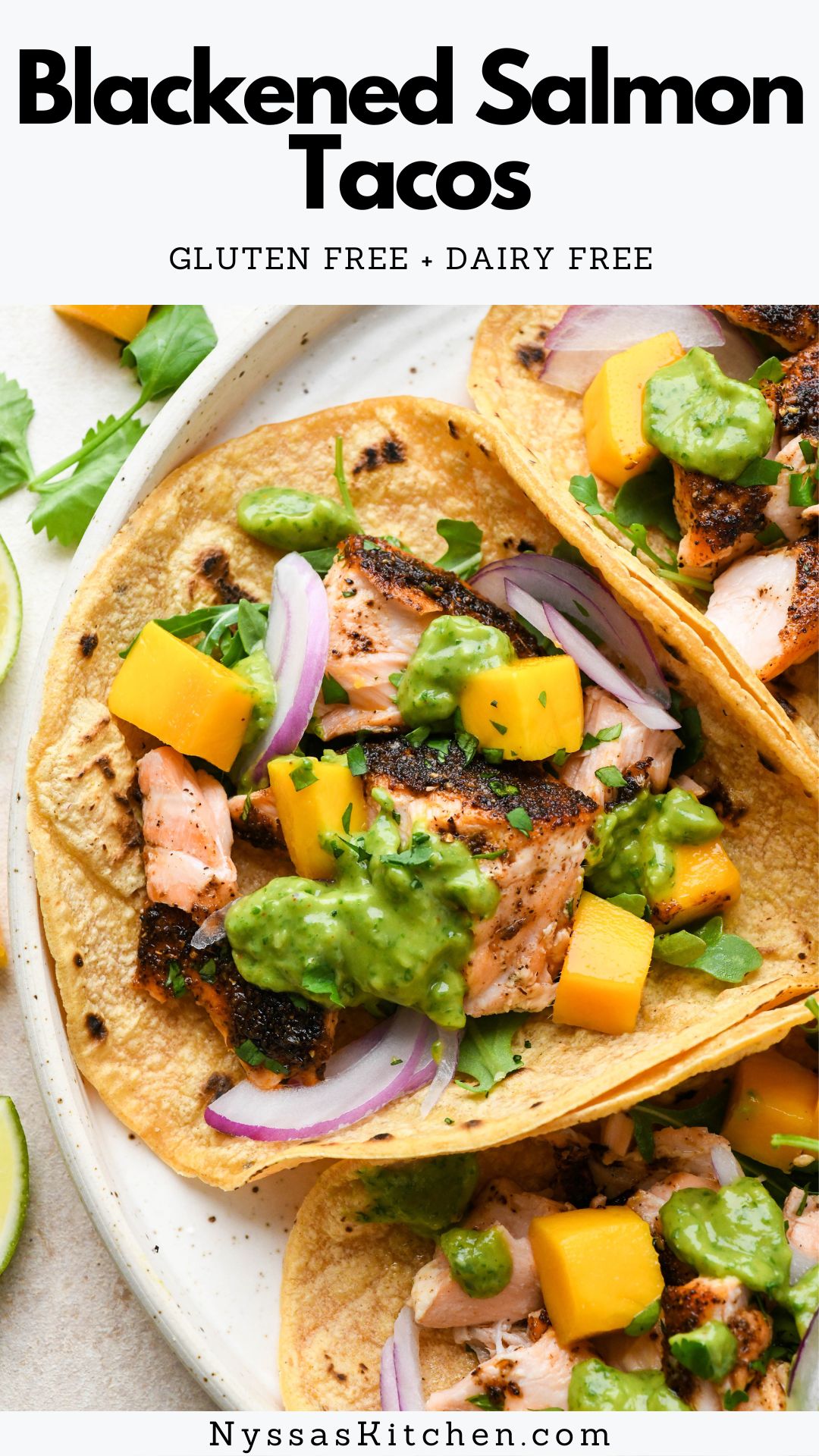 Level up your taco night by making blackened salmon tacos! Made with bold and flavorful blackened salmon and toppings like fresh mango, red onion, arugula, and a creamy avocado green sauce. A vibrant fish taco recipe that is so delicious! Gluten free, dairy free, and paleo / Whole30 option.