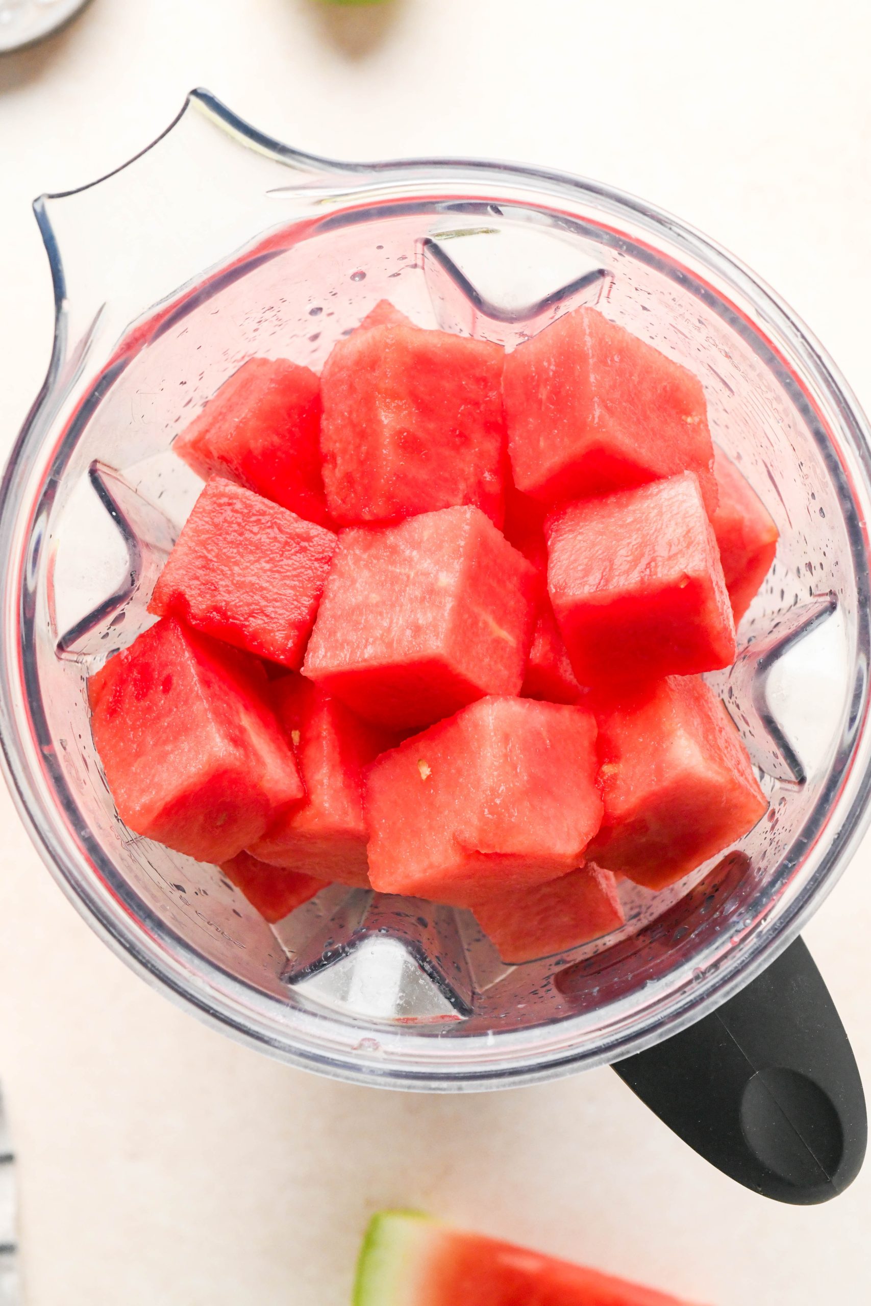 How to make watermelon juice: Cubed watermelon in a blender container.