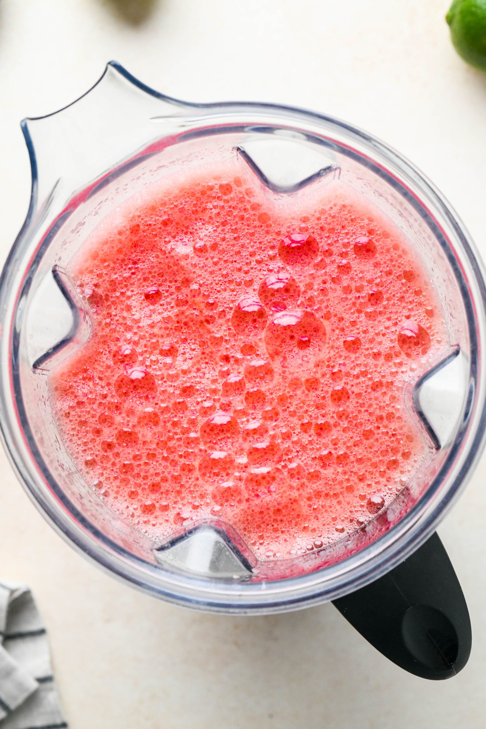 How to make watermelon juice: Blended watermelon juice in a blender container.