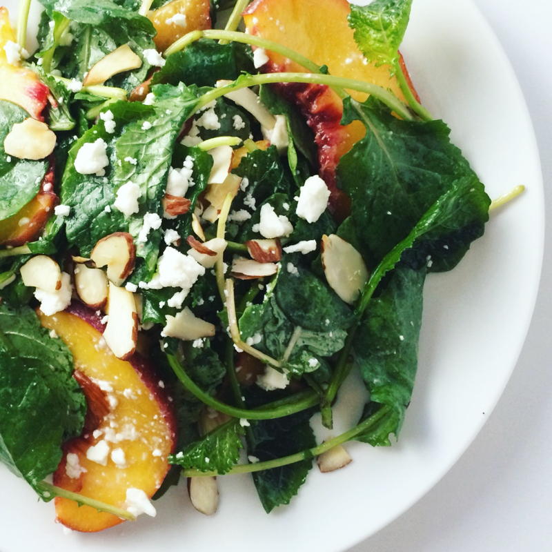 baby kale salad with peaches, feta cheese and toasted almonds | www.nyssaskitchen.com
