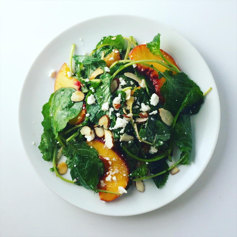 baby kale salad with peaches, feta cheese and toasted almonds | www.nyssaskitchen.com