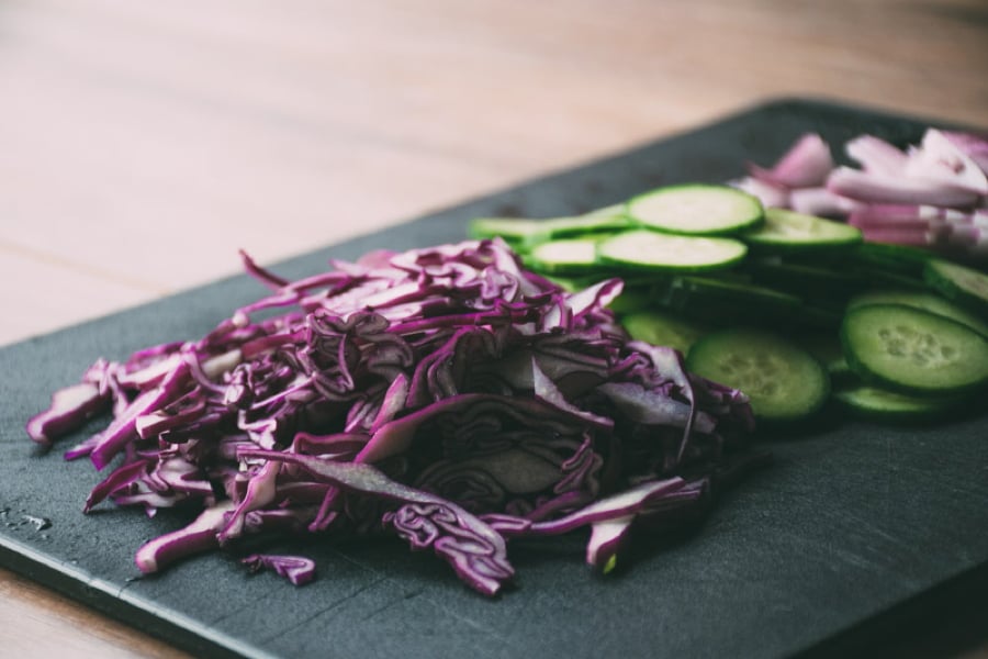 a mega healthy and flavorful recipe for garlicky miso marinated salmon with a big salad of fresh romaine and arugula, cucumbers, red cabbage and a lime and olive oil vinaigrette | www.nyssaskitchen.com