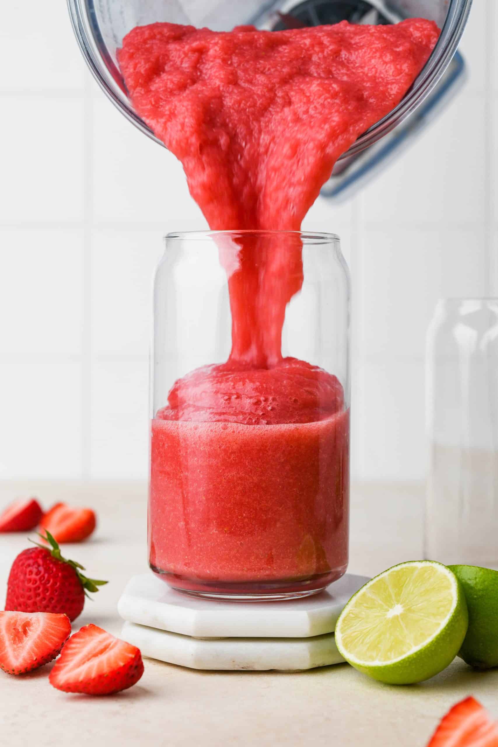 How to make Strawberry Hibiscus Slushies: Pouring slushy into glass.