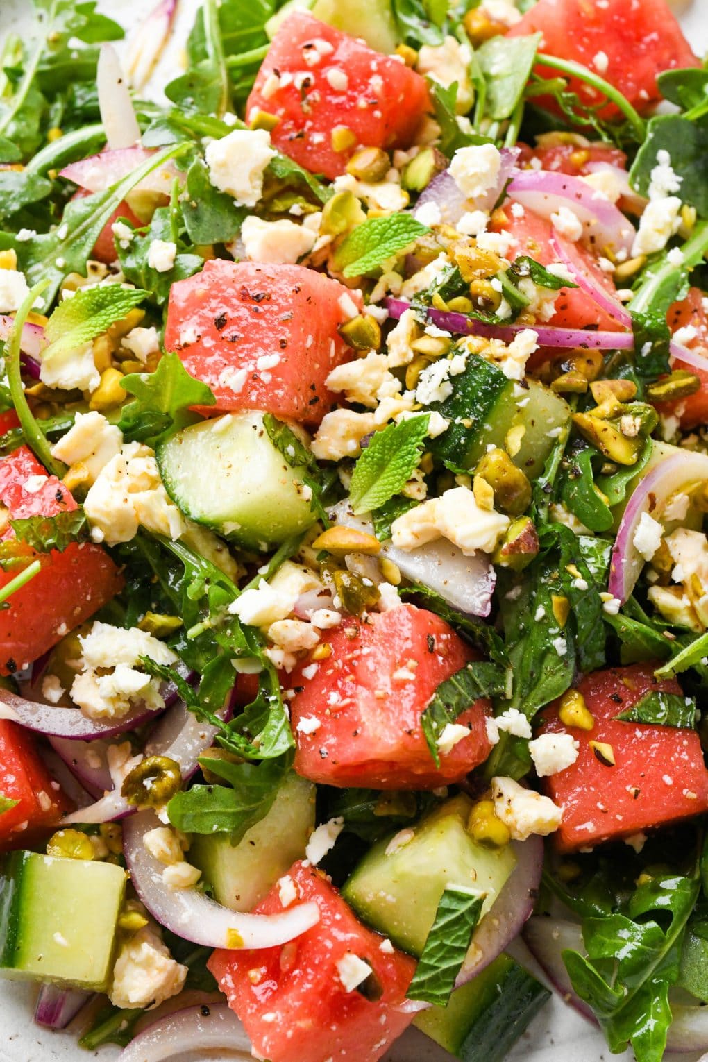 Close up image of watermelon arugula salad to show the texture.