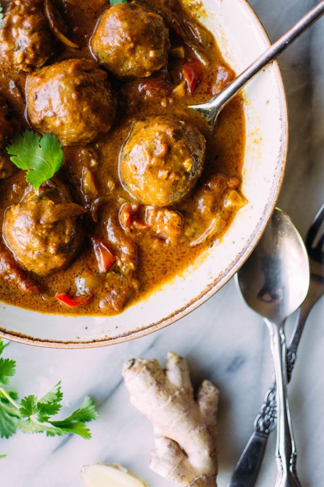 Best ever paleo curried pork meatballs! The most delicious grain free meatballs I've ever had. Perfectly spiced, sturdy yet tender, and paired with an incredibly flavorful curry sauce with red peppers, tomatoes, onion, garlic and ginger. 