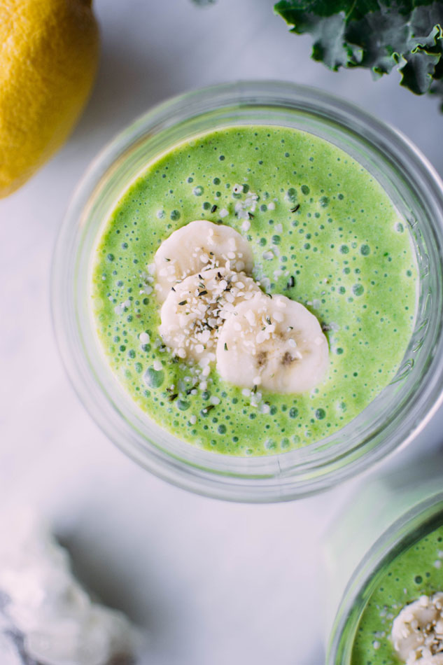 Tropical green coconut smoothie! Here to brighten up your winter vibes with kale, ginger, lemon, mango, pineapple, banana and coconut milk. Dairy free + paleo friendly. 