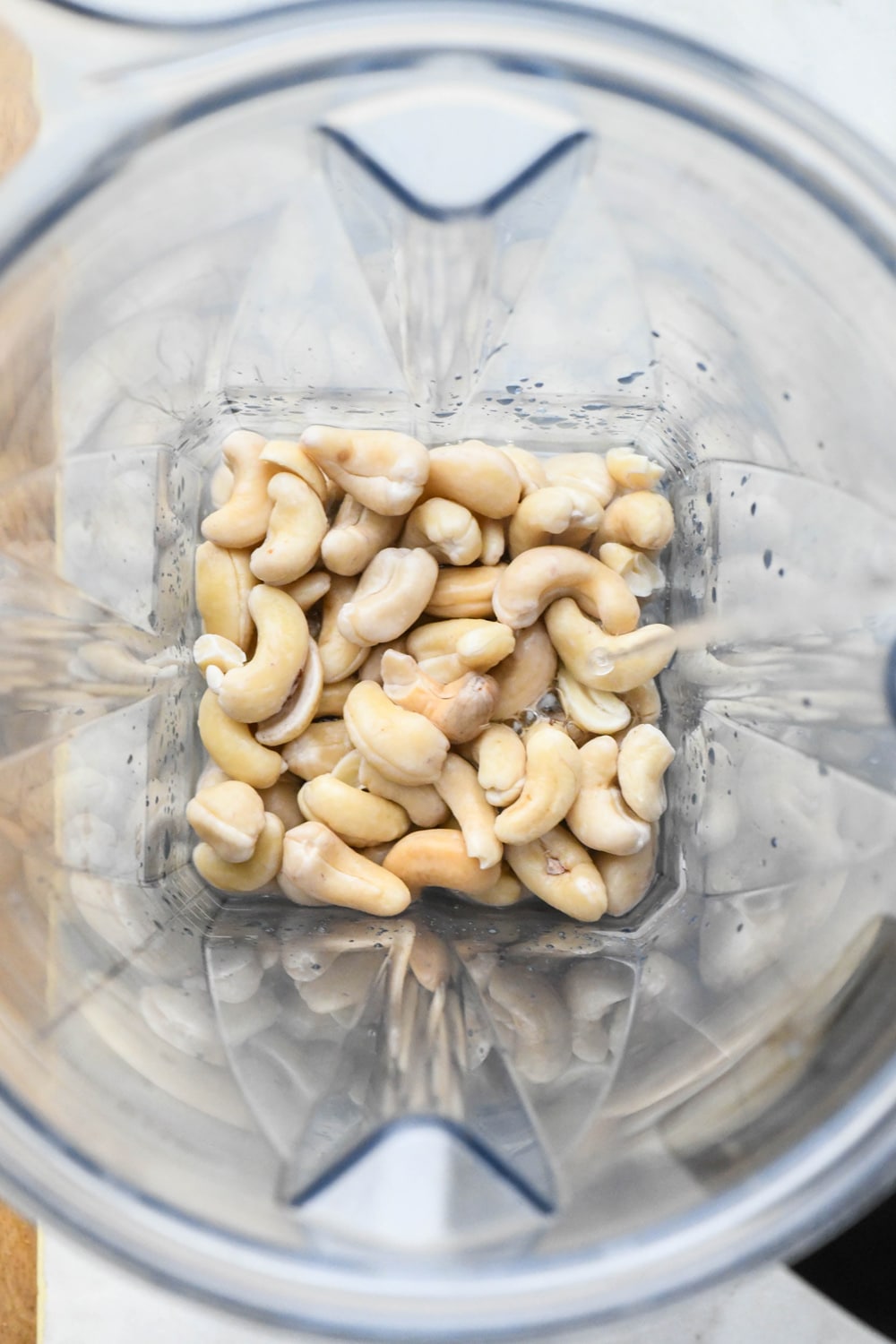 How to make cashew cream: Soaked cashews in blender container with water before blending.