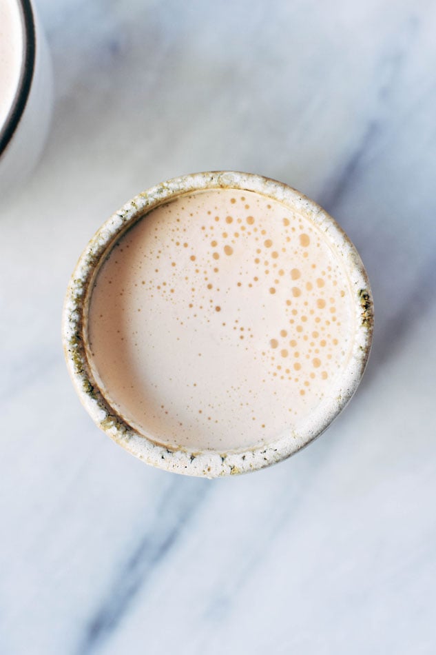 Bulletproof rooibos cardamom blender lattes! These fancy homemade drinks are a frothy, creamy dream - made with natural sweeteners and full of healthy fats and antioxidant + mineral rich rooibos! No fancy milk steamer required.