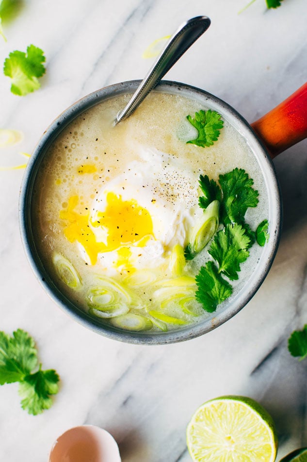 Simple sipping broth with a poached egg! Your perfect go-to healthy pick-me-up // fridge clean out meal when you need a little extra something in your life. Made with high quality broth, fresh herbs, coconut milk and a poached egg this little pot is gauranteed to having you feeling fine in no time!