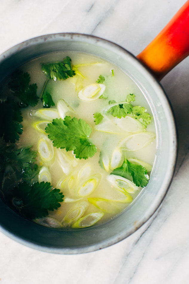 Simple sipping broth with a poached egg! Your perfect go-to healthy pick-me-up // fridge clean out meal when you need a little extra something in your life. Made with high quality broth, fresh herbs, coconut milk and a poached egg this little pot is gauranteed to having you feeling fine in no time!