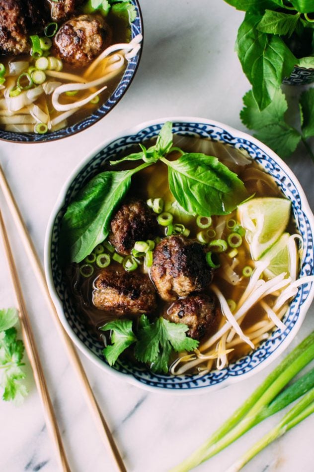 Royal pho broth with cabbage ribbons and vietnamese spiced pork meatballs - Incredibly easy and comforting pho soup that also happens to be grain free // paleo! Brimming with fragrant aromatics, tender ribbons of cabbage instead of noodles, and delightfully delicious pork meatballs.