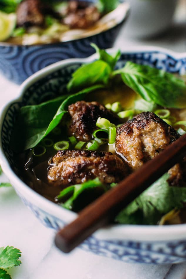 Royal pho broth with cabbage ribbons and vietnamese spiced pork meatballs - Incredibly easy and comforting pho soup that also happens to be grain free // paleo! Brimming with fragrant aromatics, tender ribbons of cabbage instead of noodles, and delightfully delicious pork meatballs.