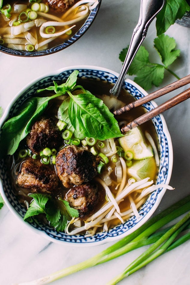 Royal pho broth with cabbage ribbons and vietnamese spiced pork meatballs - Incredibly easy and comforting pho soup that also happens to be grain free // paleo! Brimming with fragrant aromatics, tender ribbons of cabbage instead of noodles, and delightfully delicious pork meatballs.