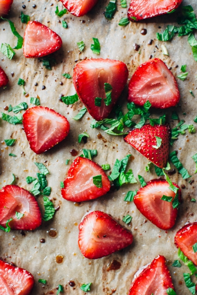 Roasted strawberries with mint and airy yogurt cream - A delightfully sweet and simple spring indulgence that's refined sugar free made with balsamic roasted strawberries, torn fresh mint, and an airy probiotic rich yogurt cream.