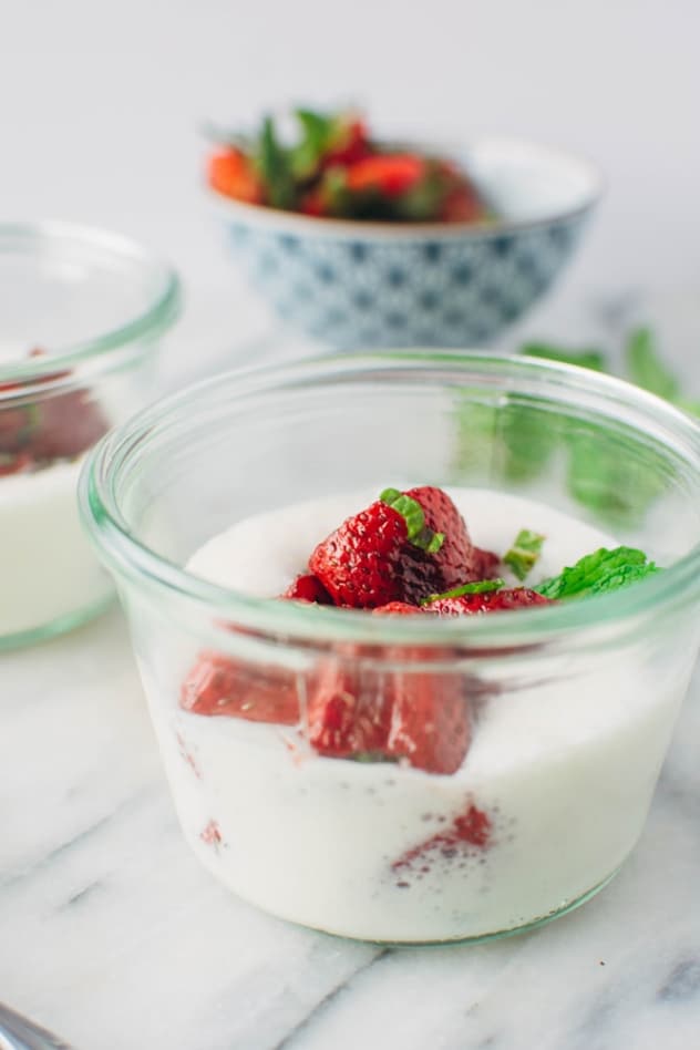 Roasted strawberries with mint and airy yogurt cream - A delightfully sweet and simple spring indulgence that's refined sugar free made with balsamic roasted strawberries, torn fresh mint, and an airy probiotic rich yogurt cream.
