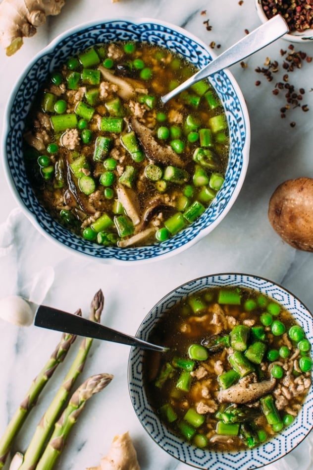 Gingered pork soup with green spring vegetables and szechuan broth made with asparagus, peas and shiitake mushrooms - it's an umami rich bowl of goodness and the perfect way to warm up AND indulge in some of the new spring vegetables that are making their way into our markets.