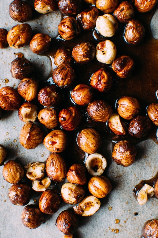 Cinnamon coffee candied hazelnuts for salted mocha hazelnut tart with Rawmio chocolate - an incredibly decadent and satisfying vegan and paleo dessert! No bake, made with nutrient dense ingredients, and sprinkled with sea salt like every great chocolate dessert should be.