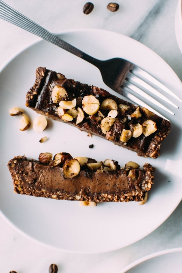 Salted mocha hazelnut tart with Rawmio chocolate is an incredibly decadent and satisfying vegan and paleo dessert! No bake, made with nutrient dense ingredients, and sprinkled with sea salt like every great chocolate dessert should be.