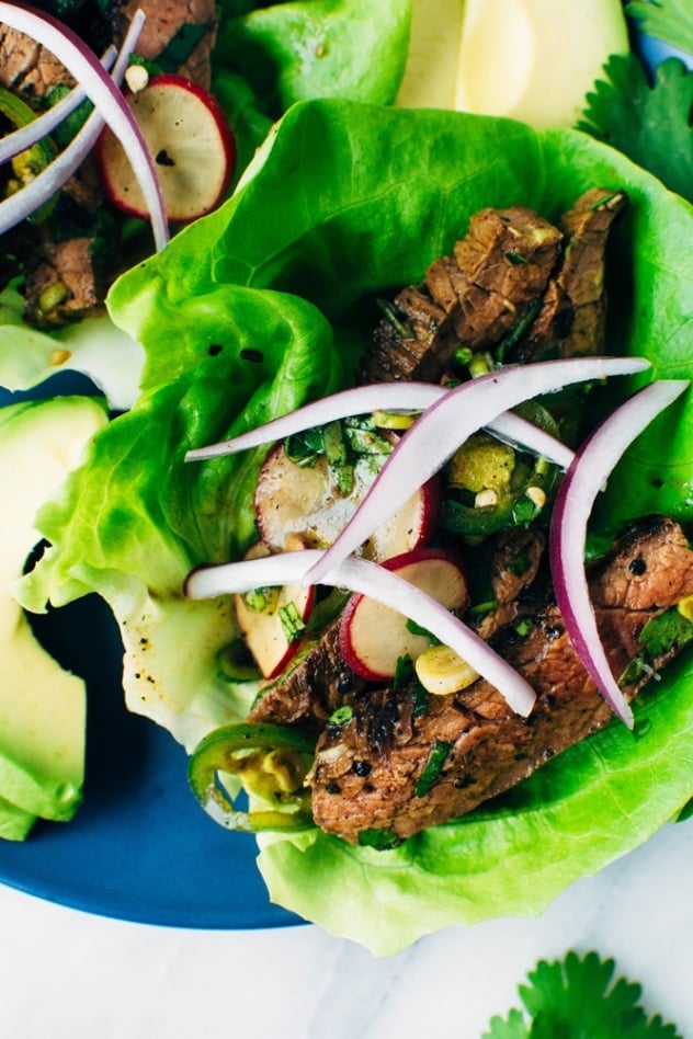 Spicy thai marinated skirt steak tacos and avocado are super bold and umami packed paleo friendly tacos that are super versatile and easy to make!