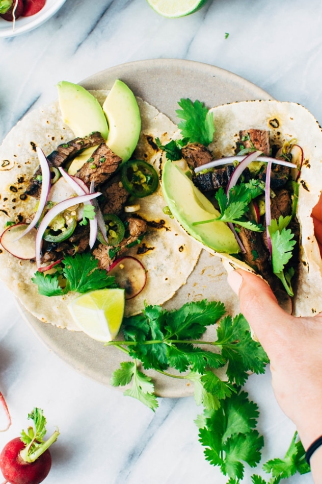 Spicy thai marinated skirt steak tacos and avocado are super bold and umami packed paleo friendly tacos that are super versatile and easy to make!