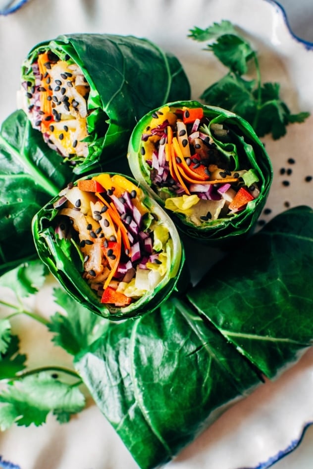 Rainbow collard green spring rolls with shrimp! Layers of tangled crunchy veggies, perfectly pan seared shrimp, spicy mayo, all tucked inside some SUPER HEALTHY collard green wraps! 