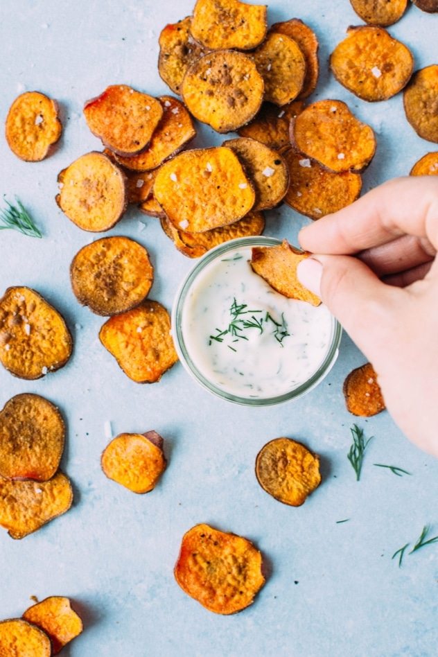 Healthy oven baked sweet potato chips with dairy free ranch dressing! A salty, crunchy and satisfying make at home snack that's loaded with anti-oxidants and healthy fats. 