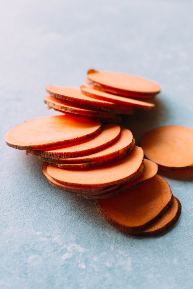 Healthy oven baked sweet potato chips with dairy free ranch dressing! A salty, crunchy and satisfying make at home snack that's loaded with anti-oxidants and healthy fats. 