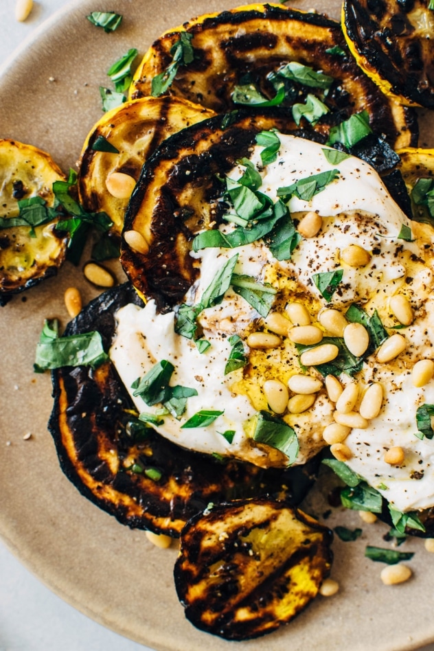 Grilled summer squash caprese salad made with silky burrata cheese, fresh basil, balsamic, plenty of olive oil and toasted pine nuts - so simple and so divine!