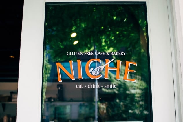 Niche - a gluten free bakery and cafe in Seattle, WA! Get ready to be tempted by some seriously mouth-watering treats as you browse their main menu since the ordering counter is lined with whatever sweet treats are fresh baked for the day - you may even be able to watch them frosting some cupcakes or pulling cookies out of the oven, as their workspace is directly behind it. Their non-bakery items menu consist mostly of various types of sandwiches, bowls, salads, and WAFFLES and waffle-inis!