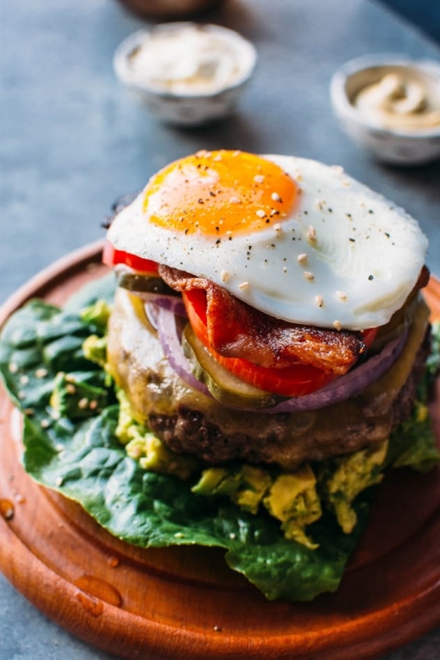 Bunless burger with toppings on a plate. 