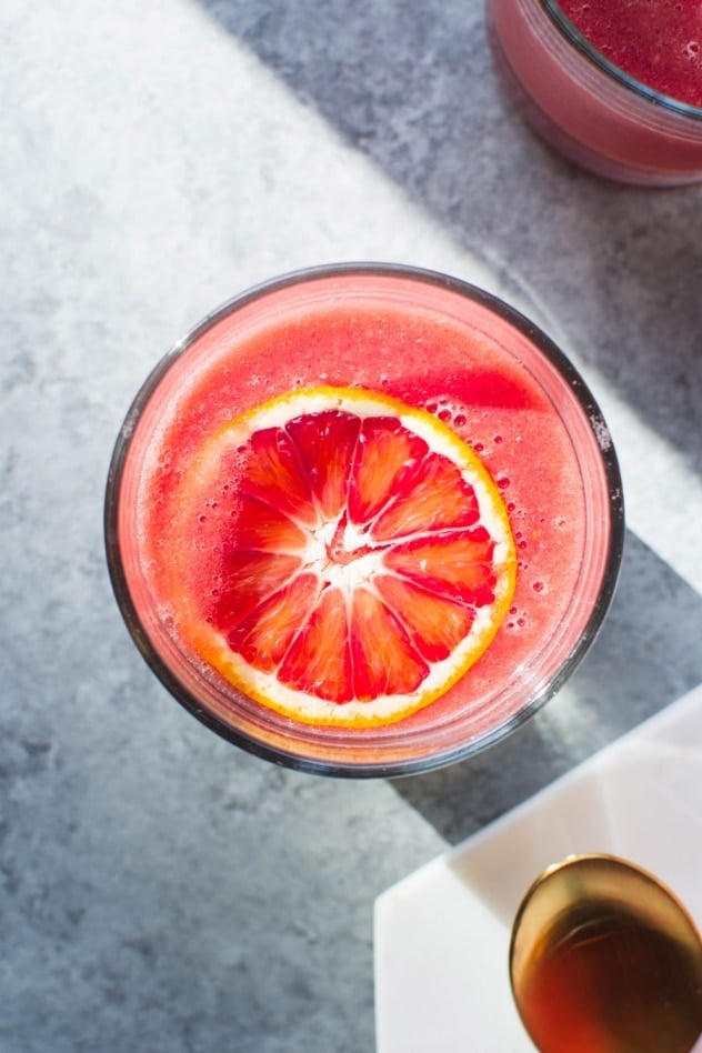 This blood orange sunshine ginger mango smoothie is made with juicy blood oranges, sweet ripe mango, bright lemon, zippy ginger and hydrating coconut water. The perfect in-between-seasons smoothie! Full of sweet and bright flavor and good for you vitamins and minerals.