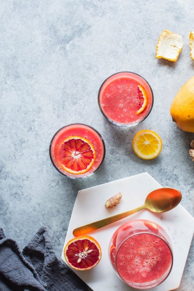 This blood orange sunshine ginger mango smoothie is made with juicy blood oranges, sweet ripe mango, bright lemon, zippy ginger and hydrating coconut water. The perfect in-between-seasons smoothie! Full of sweet and bright flavor and good for you vitamins and minerals.