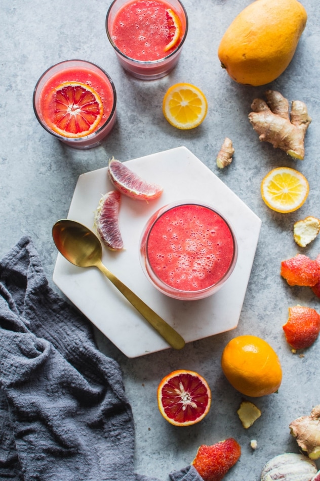 This blood orange sunshine ginger mango smoothie is made with juicy blood oranges, sweet ripe mango, bright lemon, zippy ginger and hydrating coconut water. The perfect in-between-seasons smoothie! Full of sweet and bright flavor and good for you vitamins and minerals.