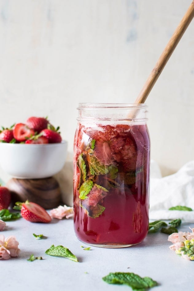 This naturally sweetened strawberry mint shrub is made with juicy seasonal strawberries, fresh mint, white balsamic vinegar, and honey! It's a brilliant bright and tart base for refreshing drinks that you'll enjoy all summer long.