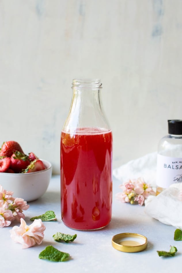 This naturally sweetened strawberry mint shrub is made with juicy seasonal strawberries, fresh mint, white balsamic vinegar, and honey! It's a brilliant bright and tart base for refreshing drinks that you'll enjoy all summer long.