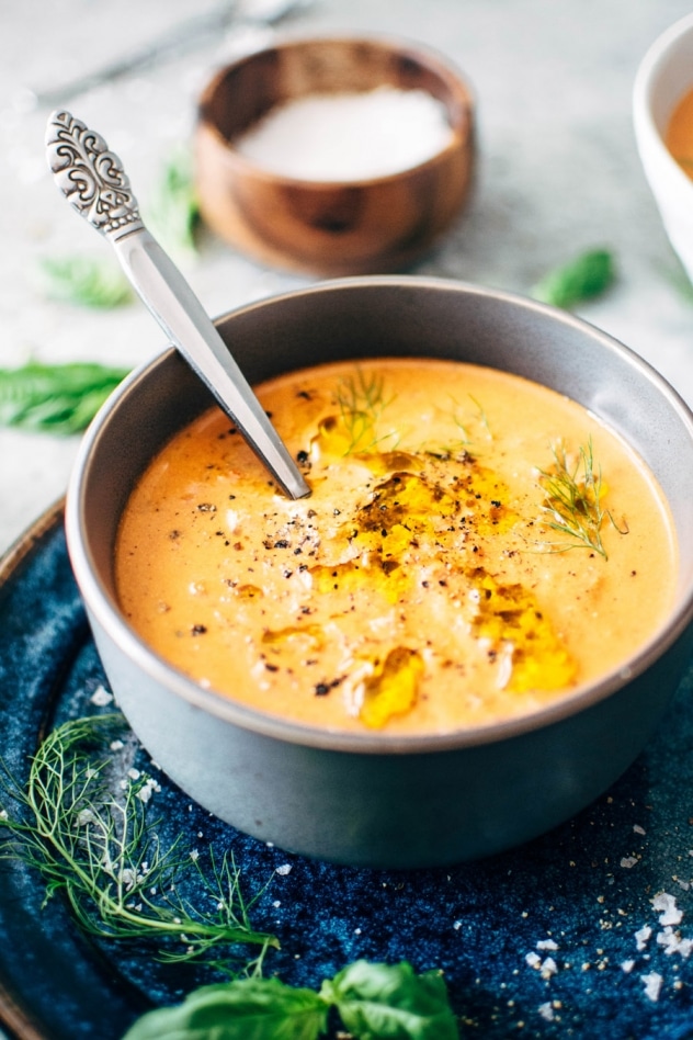 Creamy dairy free tomato and red pepper soup is naturally gluten and dairy free and bursting with summertime flavor. If there’s one soup that fits in this time of year, this tomato soup is it. Made with fresh tomatoes, sweet red pepper, lots of aromatics and soaked cashews for that ultra creamy vibe. A super healthy and comforting version of a summertime classic.