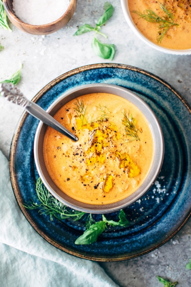 Creamy dairy free tomato and red pepper soup is naturally gluten and dairy free and bursting with summertime flavor. If there’s one soup that fits in this time of year, this tomato soup is it. Made with fresh tomatoes, sweet red pepper, lots of aromatics and soaked cashews for that ultra creamy vibe. A super healthy and comforting version of a summertime classic.