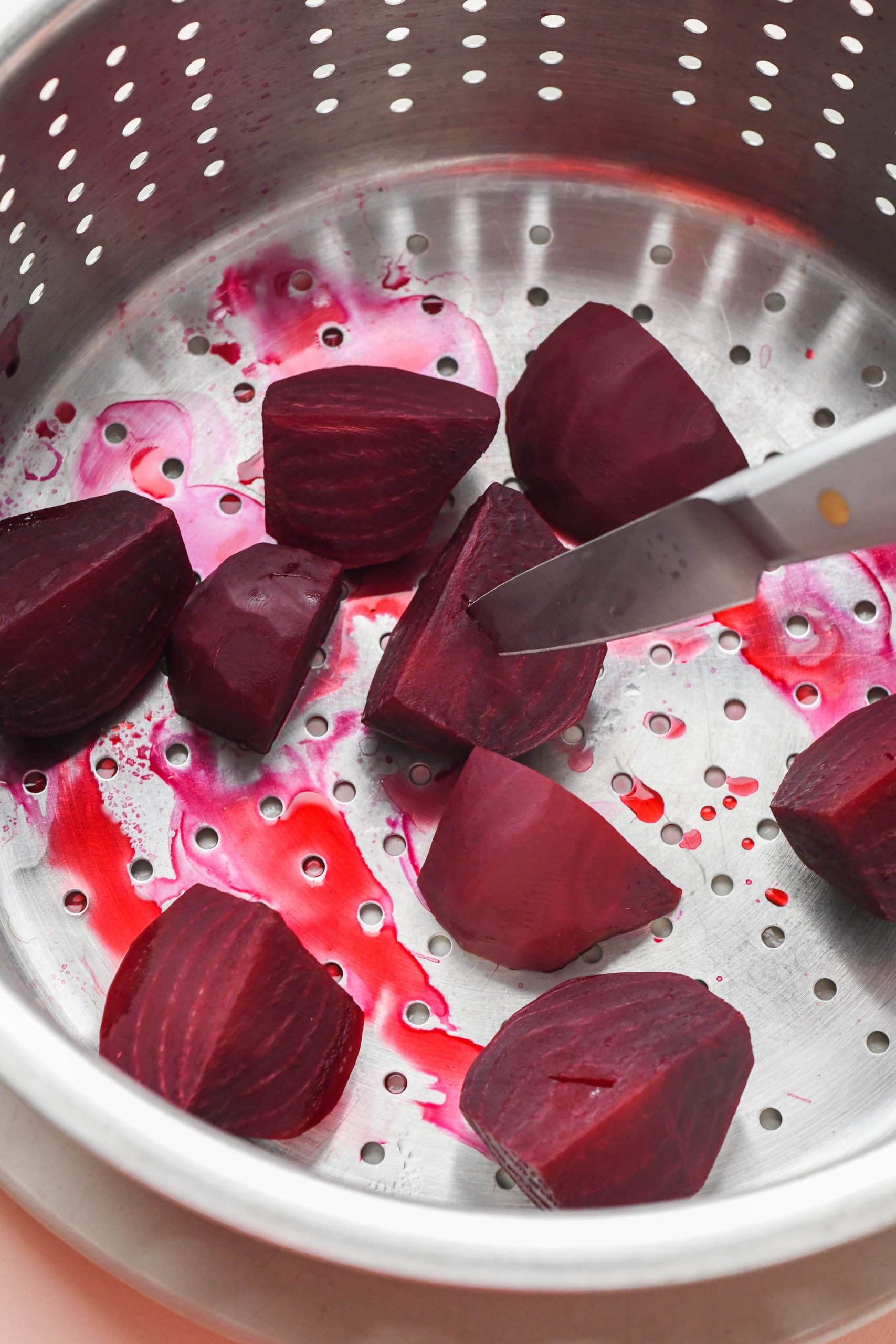 How to make cashew beet dip: Beets in a steamer basket.