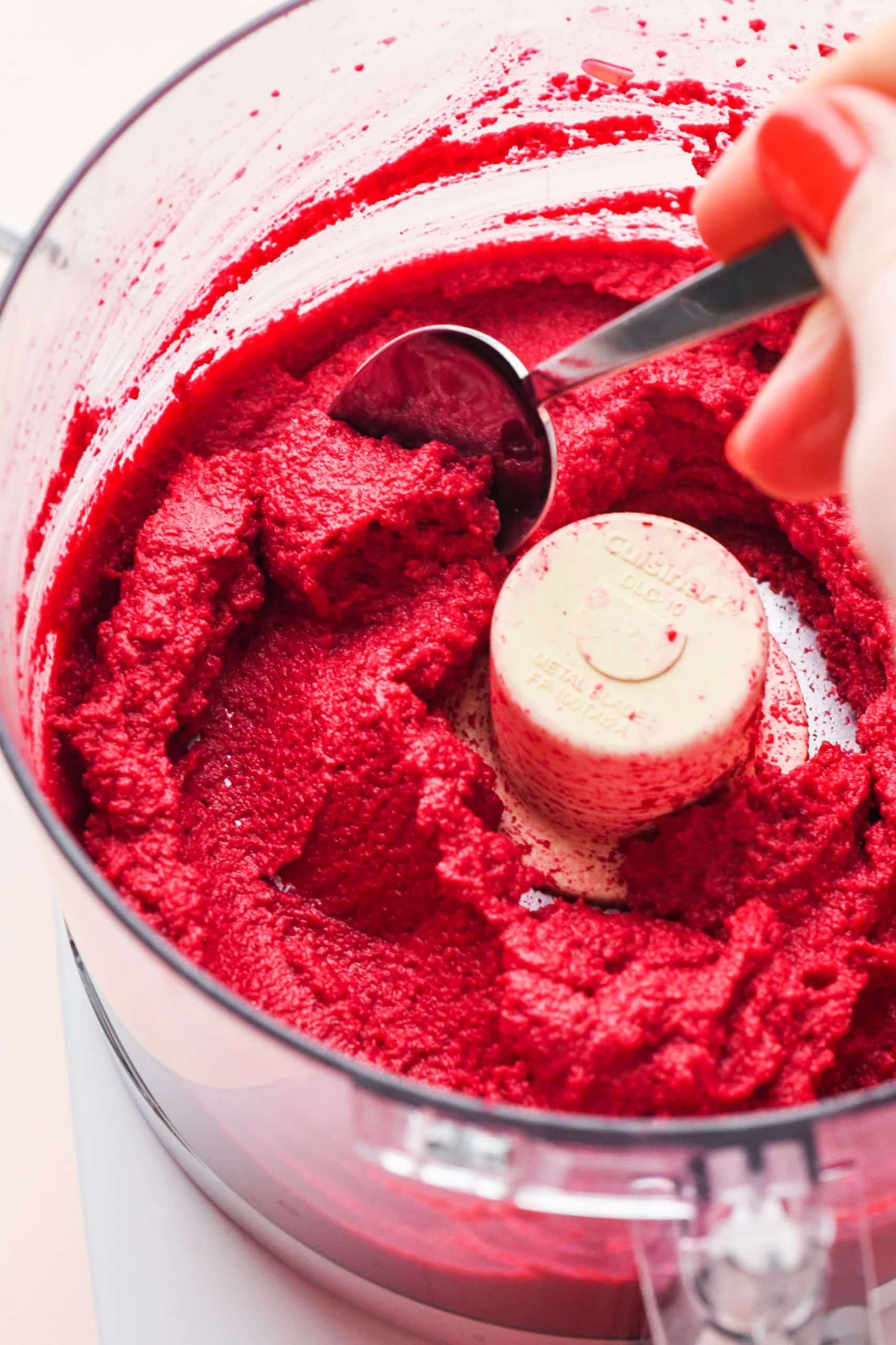 How to make cashew beet dip: Blended beet dip in the bowl of a food processor.