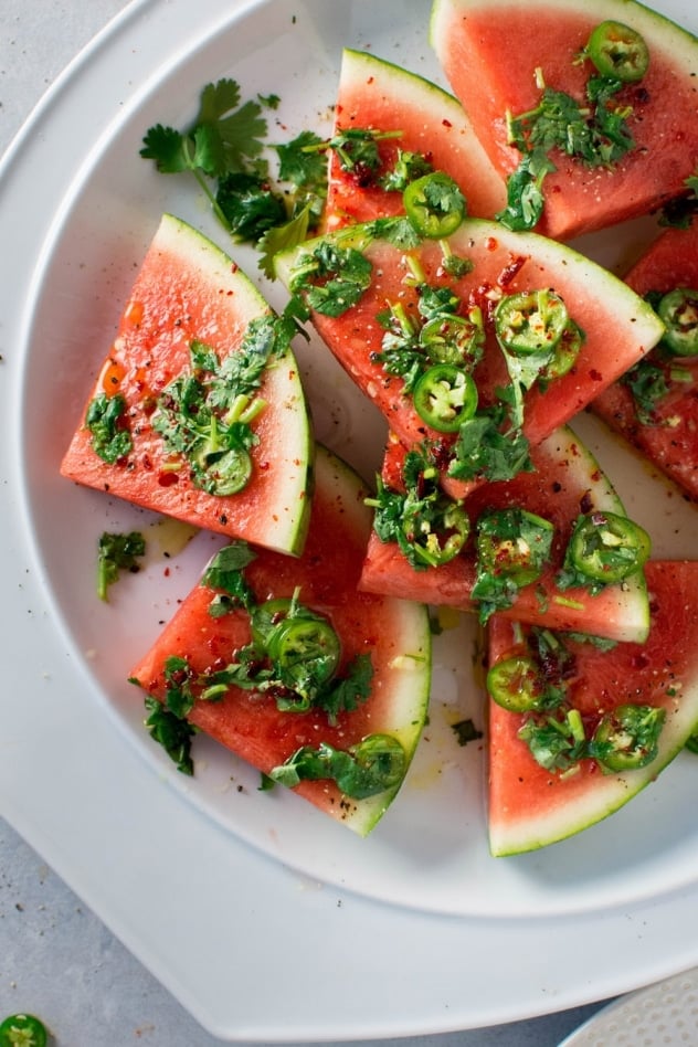 Are you guys ready for this insanely delicious spicy watermelon salad with cilantro and lime!? It's spicy, sweet, a little bit salty and doused in a super lime-y dressing for the ultimate watermelon salad experience - refreshing and FULL of summer flavor! 