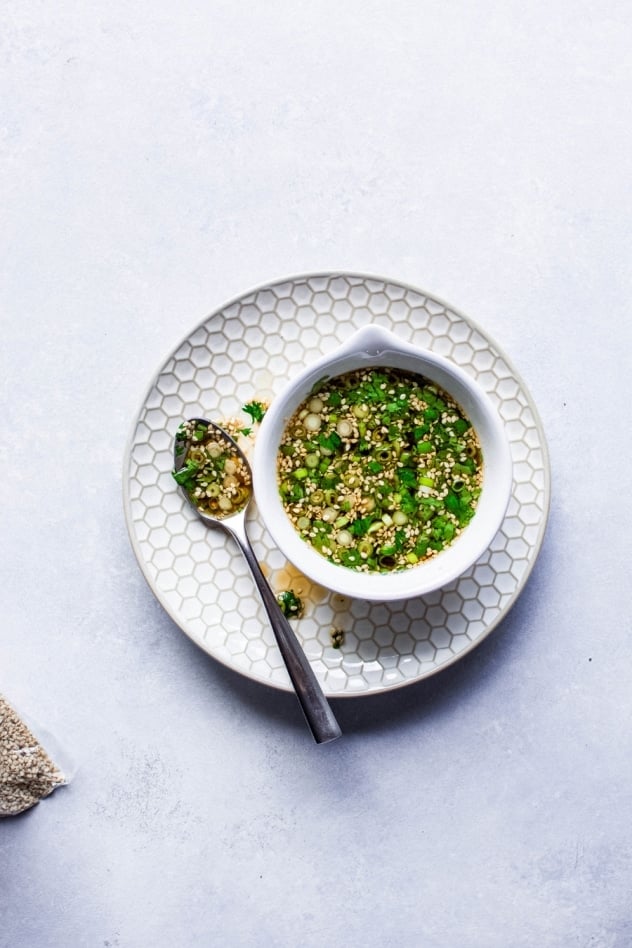 This 5 minute paleo green onion cilantro sauce is MAGIC, you guys. One of those sauces that you can make a million times and eat with every type of meal - from roasted veggies to a cast iron steak to buckwheat noodles. Ready in a flash and made with minimal ingredients, it will take an any meal from good to amazing!