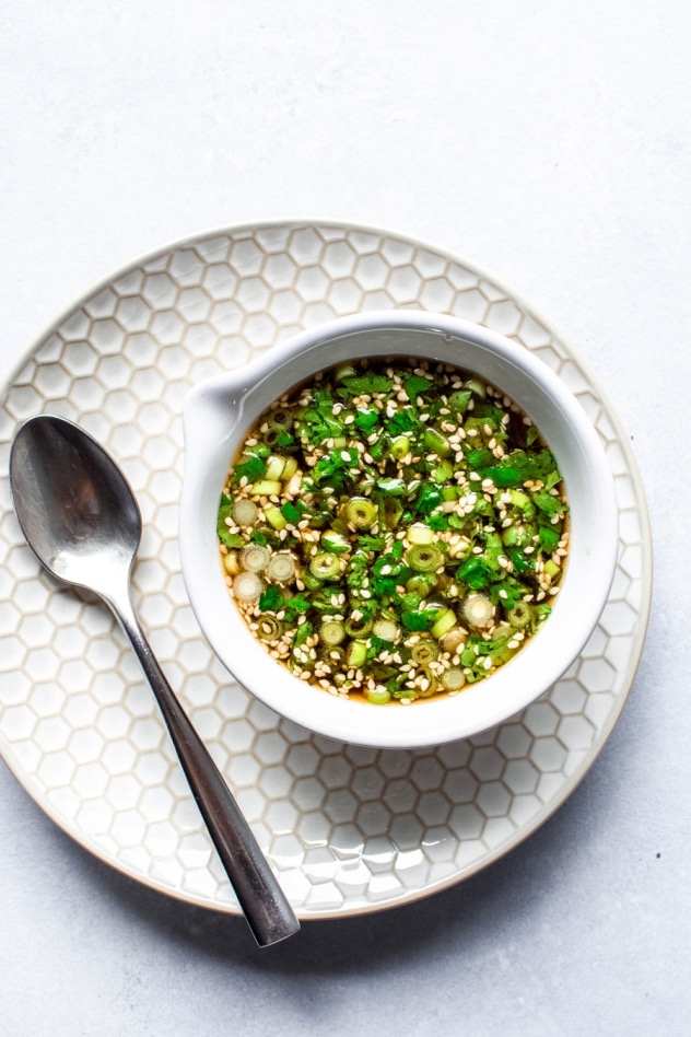 This 5 minute paleo green onion cilantro sauce is MAGIC, you guys. One of those sauces that you can make a million times and eat with every type of meal - from roasted veggies to a cast iron steak to buckwheat noodles. Ready in a flash and made with minimal ingredients, it will take an any meal from good to amazing!