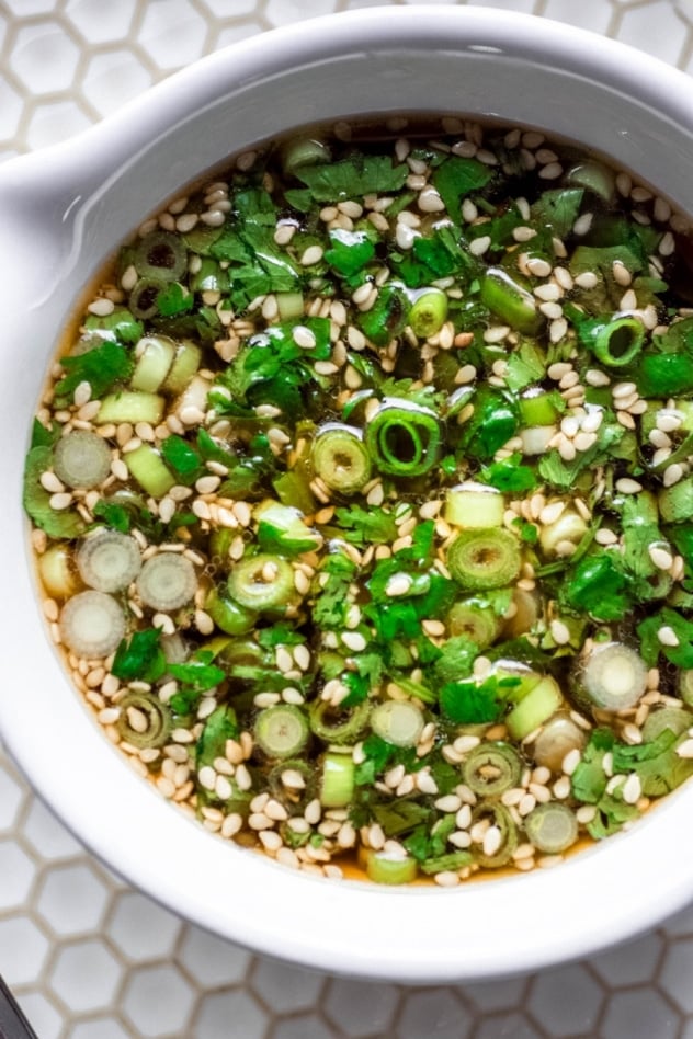 This 5 minute paleo green onion cilantro sauce is MAGIC, you guys. One of those sauces that you can make a million times and eat with every type of meal - from roasted veggies to a cast iron steak to buckwheat noodles. Ready in a flash and made with minimal ingredients, it will take an any meal from good to amazing!