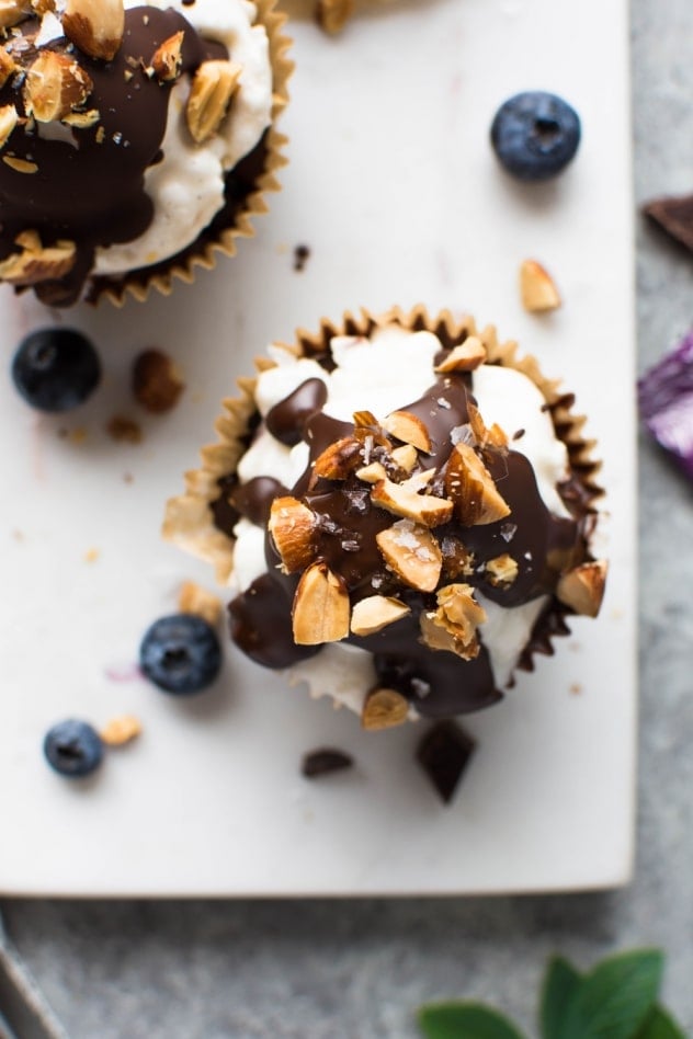 These dark chocolate blueberry almond ice cream cups are gluten free and vegan - made with your favorite non dairy ice cream, the BEST only-slightly-sweet chocolate from Rawmio, almond butter, blueberries, and salty toasted almonds for a mouth-watering combo that will knock you off your feet! 