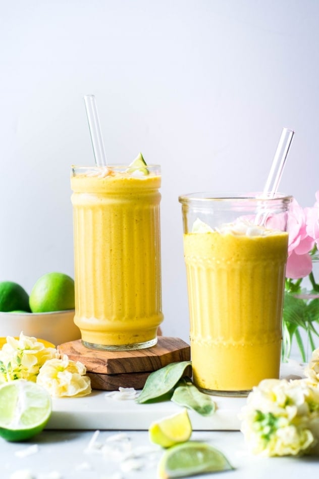 This mango coconut smoothie with turmeric and lime is not too sweet, but slightly floral and aromatic from the perfectly ripe mango, a bright clean layer of flavor from all that fresh lime juice that wakes up your taste buds, a little tropical creamy thing happening thanks to the coconut milk, and some anti-inflammatory love for your bod from the bold and vibrant turmeric. 