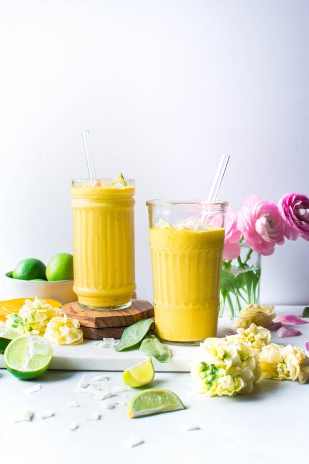 This mango coconut smoothie with turmeric and lime is not too sweet, but slightly floral and aromatic from the perfectly ripe mango, a bright clean layer of flavor from all that fresh lime juice that wakes up your taste buds, a little tropical creamy thing happening thanks to the coconut milk, and some anti-inflammatory love for your bod from the bold and vibrant turmeric. 