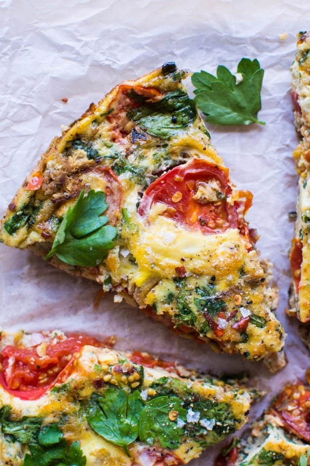 This late summer frittata with tomatoes and fresh herbs has been my go-to egg dish pretty much since it's been warm enough to wear sandals! Made with good-for-you pasture raised eggs, ripe summer tomatoes, savory caramelized shallots, spinach, and fresh parsley for some seriously delicious flavor - it's a must try!