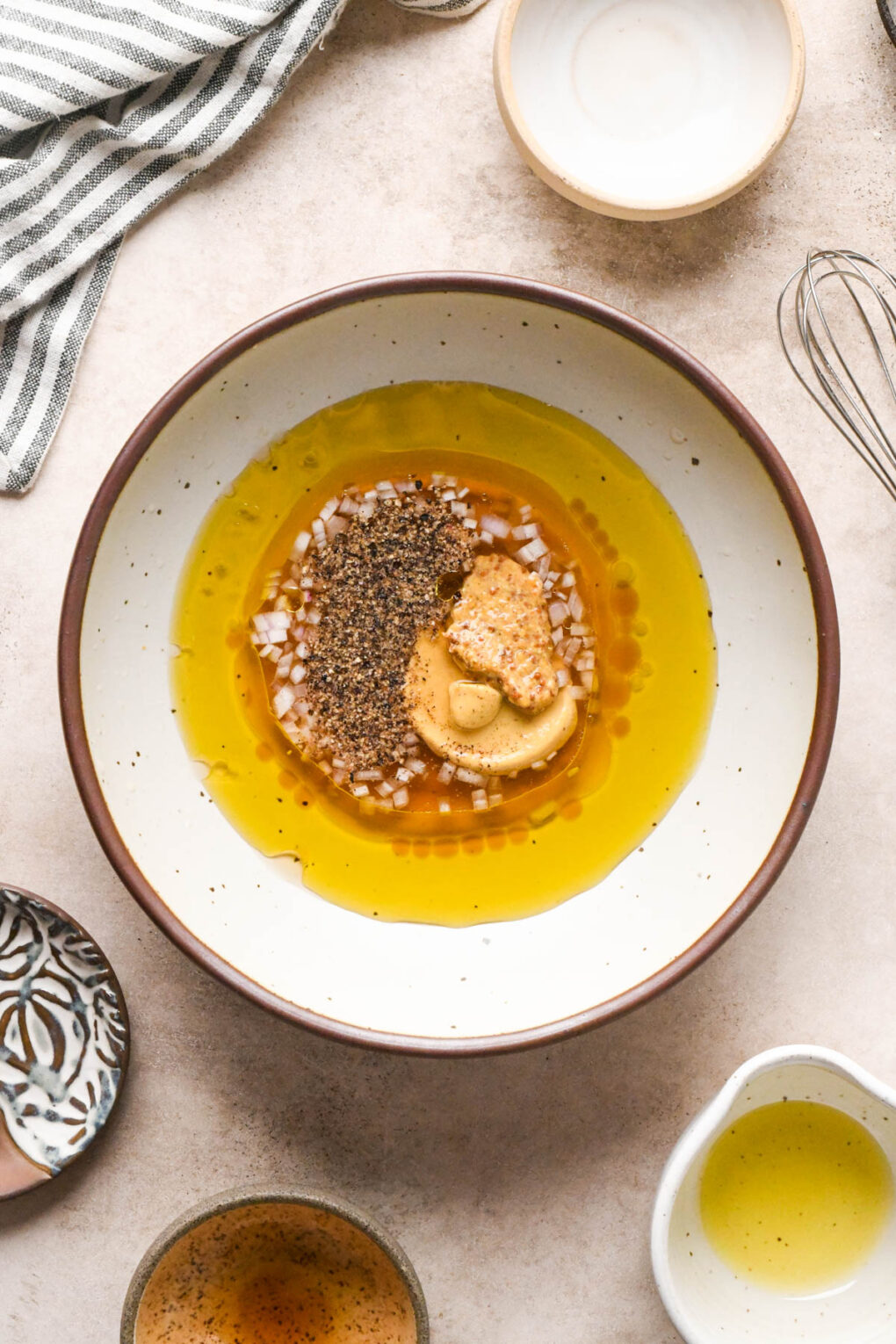 How to make Asian Pear and Walnut Salad with Maple Mustard Dressing: All ingredients for the dressing in a medium-sized ceramic bowl, before whisking together.