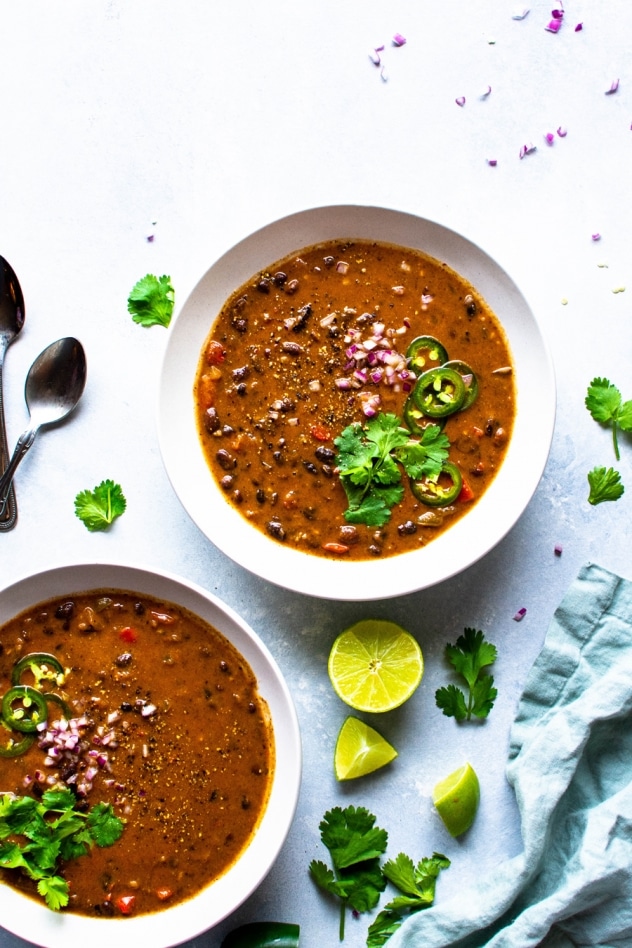 The best vegan black bean soup is made with simple ingredients like canned black beans, veggies and some flavorful spices. Hearty and full of flavor and nutrition! Top it with your favorite garnishes like cilantro, red onion and lots of lime for a satisfying and easy soup! 